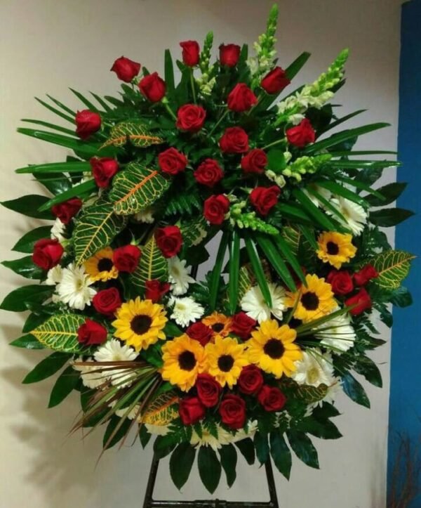 Corona fúnebre de girasoles y rosas
